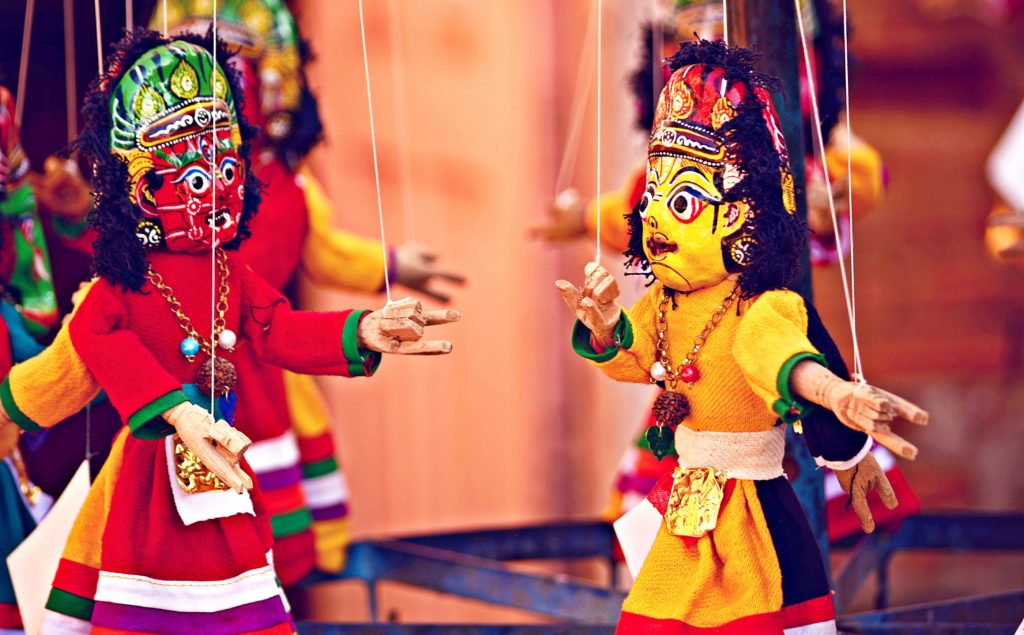 Picture of two Indian style dancing puppets