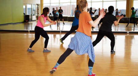 Group of women doing dance based exercise
