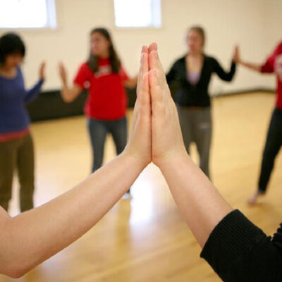 Group of women is a circle is a dance music therapy workshop